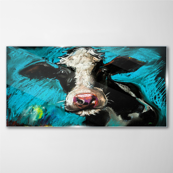 Glasbild Porträt einer Kuh auf blauem Hintergrund