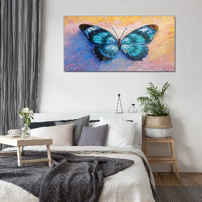Foto auf glas Blauer Schmetterling auf pastellfarbenem Hintergrund
