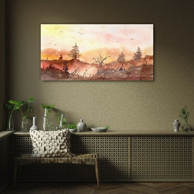 Glasbild Sonnenuntergang über einer Waldlandschaft