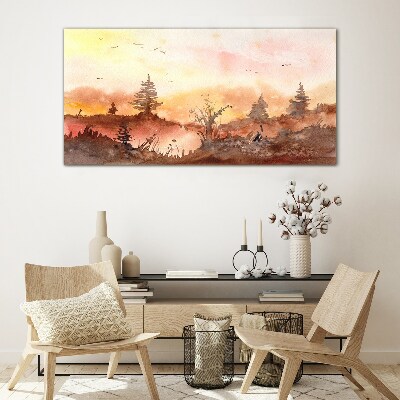 Glasbild Sonnenuntergang über einer Waldlandschaft