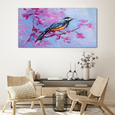 Glasbild Frühlingsvogel auf rosa Zweigen