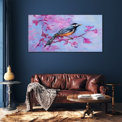 Glasbild Frühlingsvogel auf rosa Zweigen