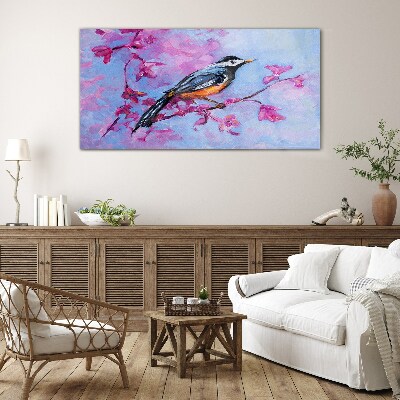 Glasbild Frühlingsvogel auf rosa Zweigen