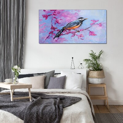 Glasbild Frühlingsvogel auf rosa Zweigen