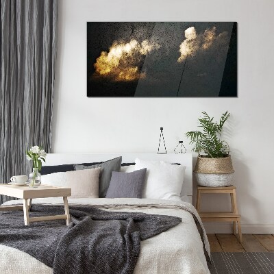 Glasbild Goldene Wolken auf dunklem Hintergrund