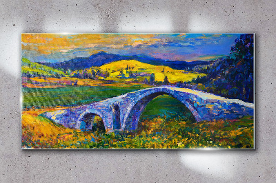 Glasbild Regenbogenbrücke in malerischer Landschaft