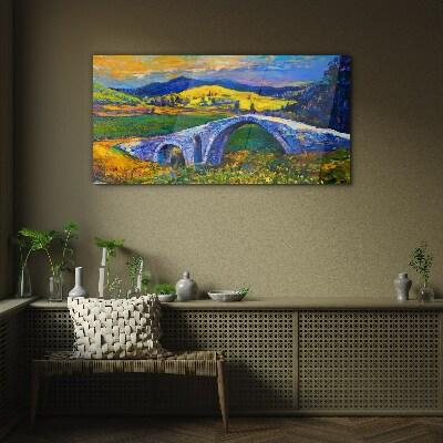Glasbild Regenbogenbrücke in malerischer Landschaft