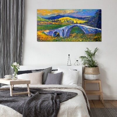 Glasbild Regenbogenbrücke in malerischer Landschaft