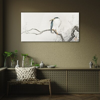 Glasbild Ein Vogel auf einem Ast in einer zarten Landschaft