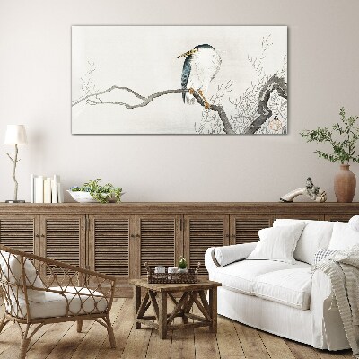 Glasbild Ein Vogel auf einem Ast in einer zarten Landschaft