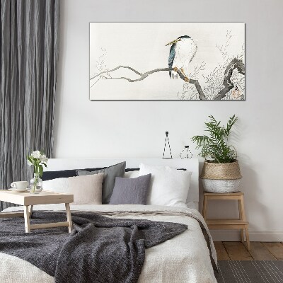 Glasbild Ein Vogel auf einem Ast in einer zarten Landschaft