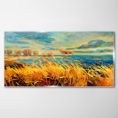 Glasbild Goldenes Gras über blauem Wasser