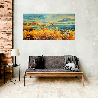 Glasbild Goldenes Gras über blauem Wasser