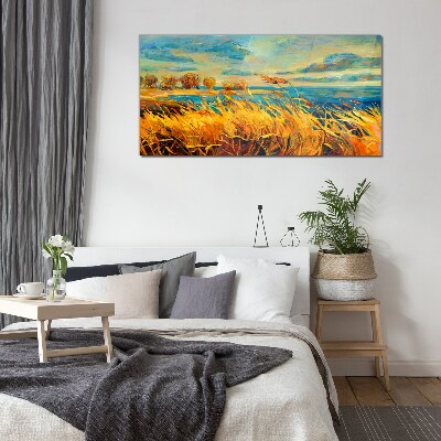 Glasbild Goldenes Gras über blauem Wasser