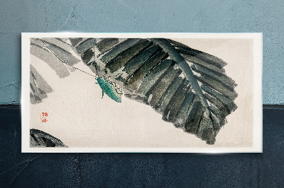 Glasbild Ein schlankes Insekt auf Blättern