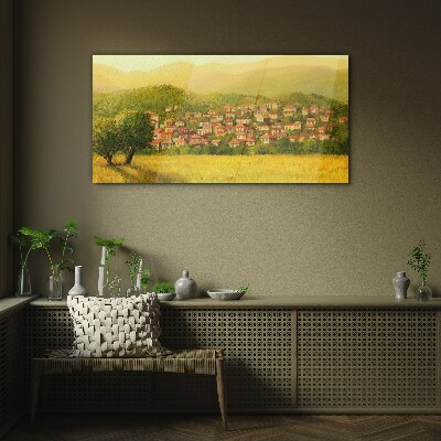 Glasbild Ein sonniges Dorf inmitten der Hügel