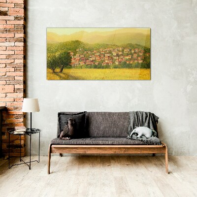 Glasbild Ein sonniges Dorf inmitten der Hügel