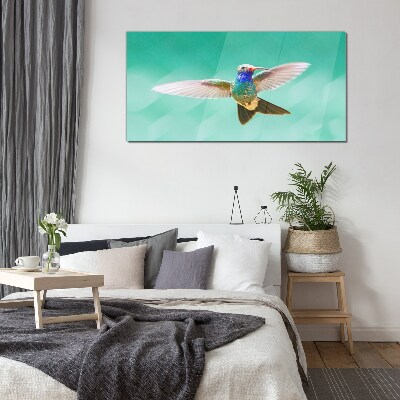 Glasbild Kolibri auf blauem Hintergrund