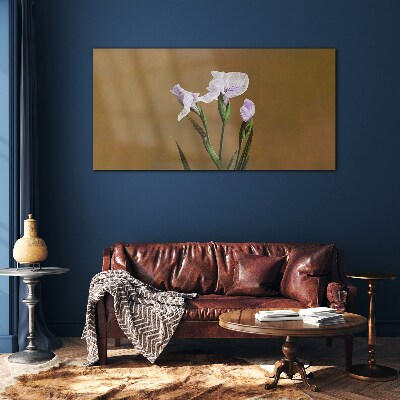 Glasbild Irisblüten auf braunem Hintergrund