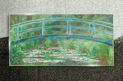 Glasbild Eine Brücke über den Teich