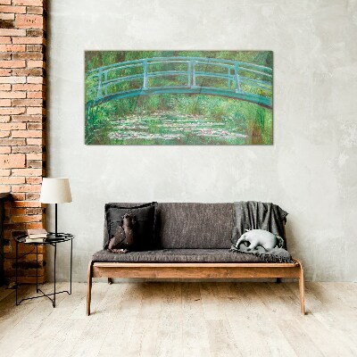 Glasbild Eine Brücke über den Teich