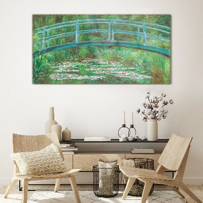 Glasbild Eine Brücke über den Teich