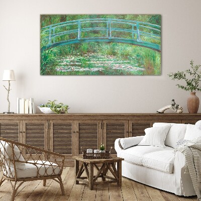 Glasbild Eine Brücke über den Teich
