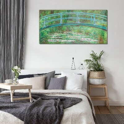 Glasbild Eine Brücke über den Teich