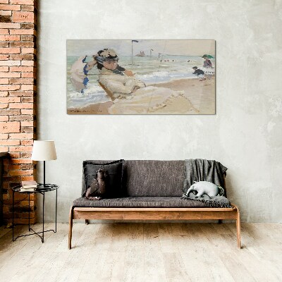 Glasbild Frau am Strand mit einem Sonnenschirm
