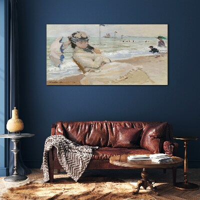 Glasbild Frau am Strand mit einem Sonnenschirm