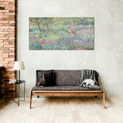 Glasbild Blumengarten in der Frühlingssonne