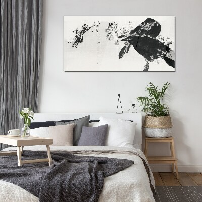 Glasbild Schwarzer Vogel vor dem Hintergrund der Natur