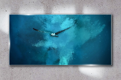 Glasbild Ein Vogel im blauen Raum