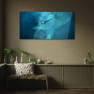 Glasbild Ein Vogel im blauen Raum