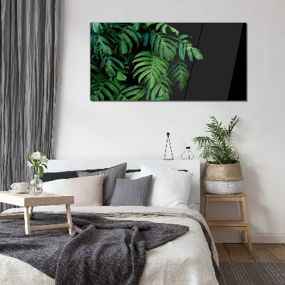 Glasbild Grüne Blätter auf schwarzem Hintergrund