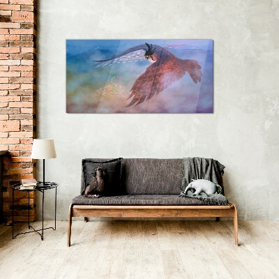 Foto glasbild Flug eines Raubvogels in den Wolken