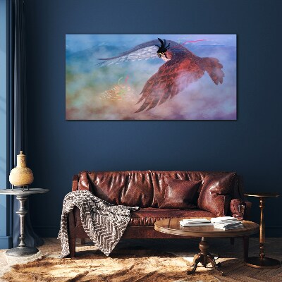 Foto glasbild Flug eines Raubvogels in den Wolken