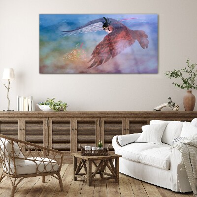 Foto glasbild Flug eines Raubvogels in den Wolken