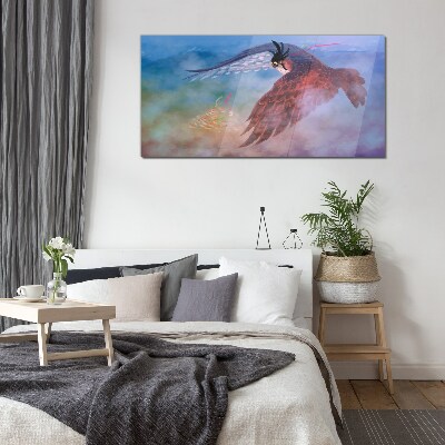 Foto glasbild Flug eines Raubvogels in den Wolken