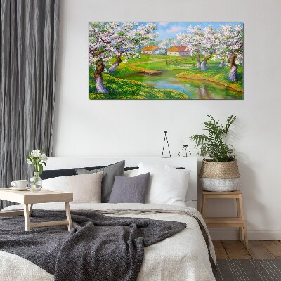 Glasbild Frühlingslandschaft mit blühenden Bäumen