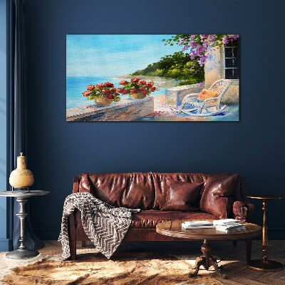 Glasbild Blumen und Meer in einer sonnigen Landschaft