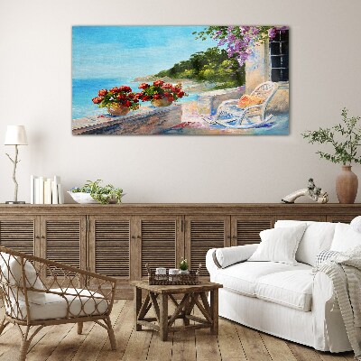 Glasbild Blumen und Meer in einer sonnigen Landschaft