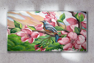 Foto glasbild Ein Vogel vor einem Hintergrund aus Frühlingsblumen