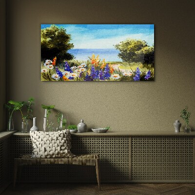 Glasbild Landschaft mit Blumen am Meer