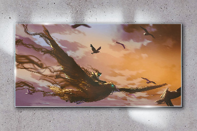 Glasbild Vogelflug in der untergehenden Sonne