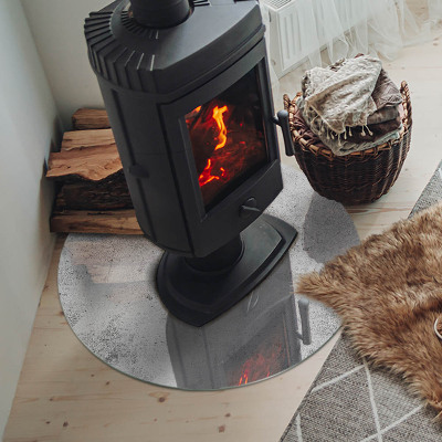 Runde Kamin Glasplatte Rohbetonstruktur