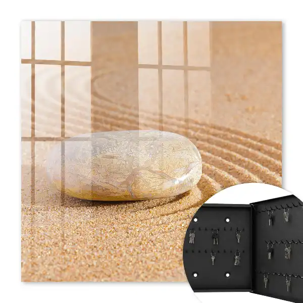 Stein im Sand, sanfte Wellen