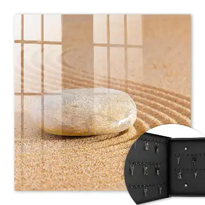 Stein im Sand, sanfte Wellen
