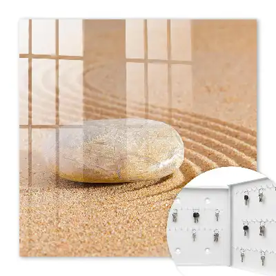 Stein im Sand, sanfte Wellen