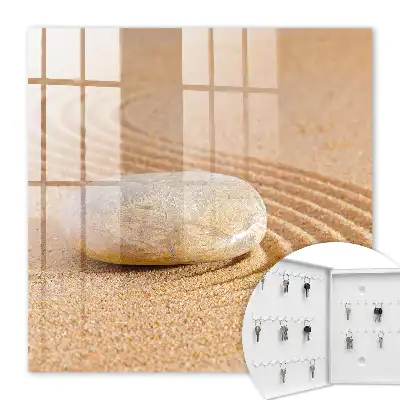 Stein im Sand, sanfte Wellen